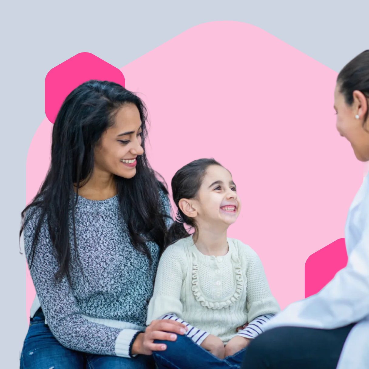 Image of a mother and daughter in front of a pale pink hexagon